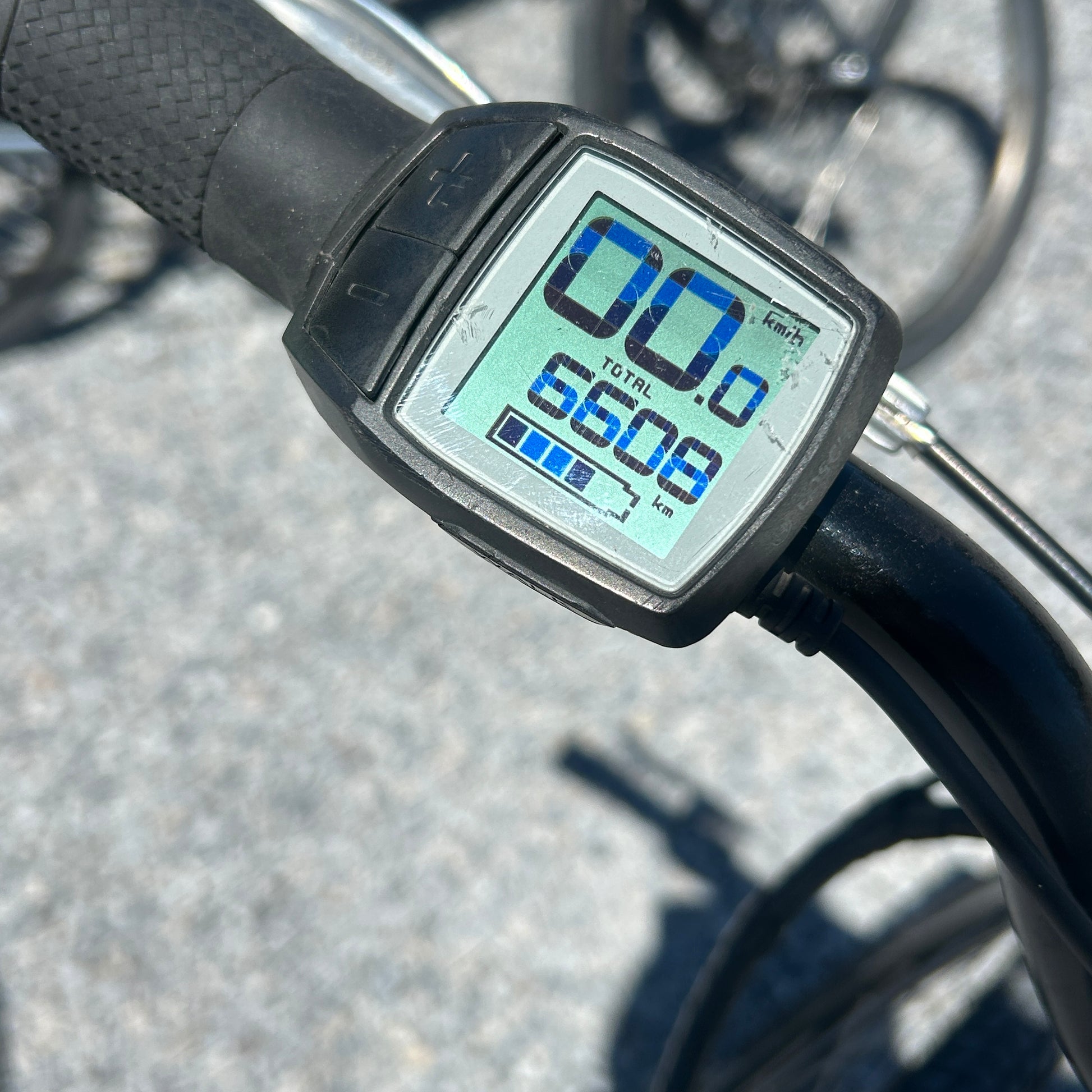 Digital display on a bicycle handlebar showing distance traveled.