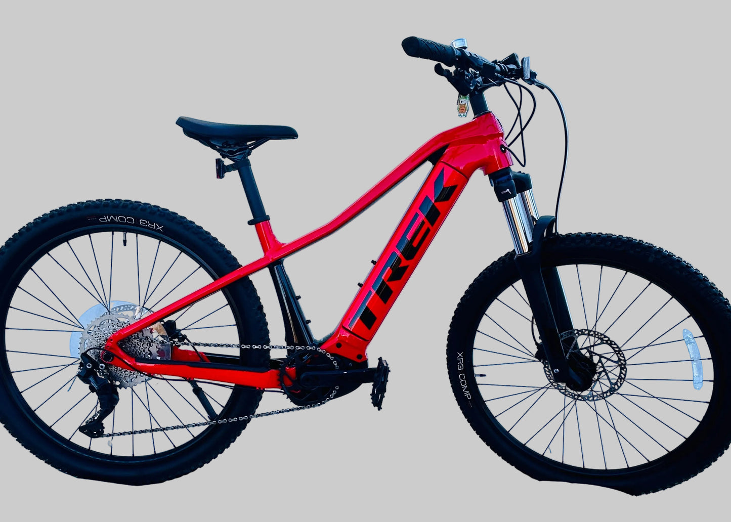 Red Trek bicycle on a gray background