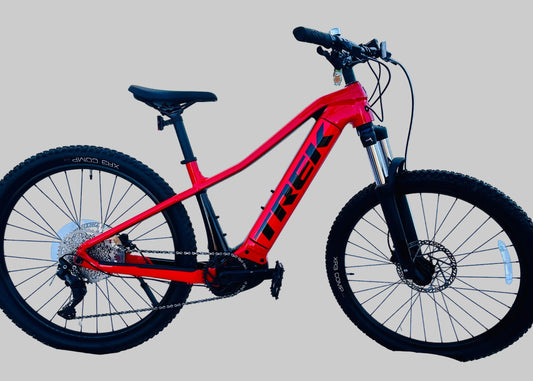 Red Trek bicycle on a gray background