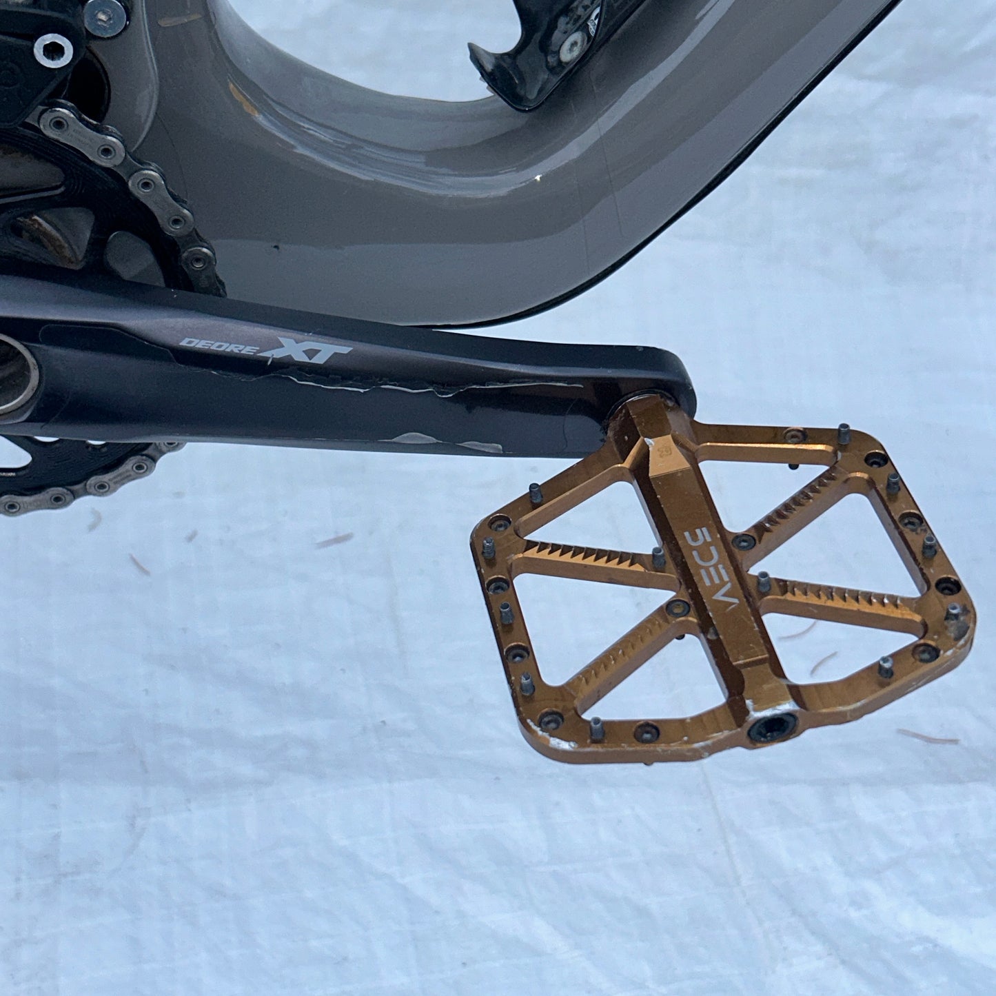 Close-up of a bicycle pedal with 'Shimano' branding on a white background